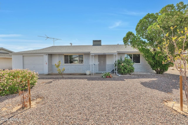 ranch-style home with a garage