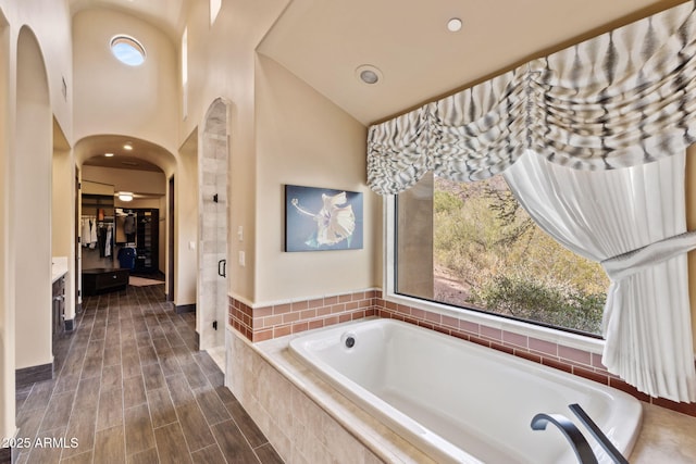 bathroom featuring vanity and a garden tub