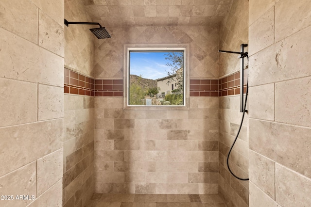 full bath featuring a tile shower