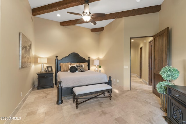 bedroom featuring ceiling fan, baseboards, a high ceiling, and beam ceiling