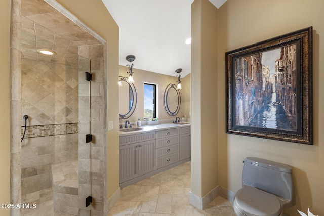 bathroom featuring baseboards, a sink, and a shower stall
