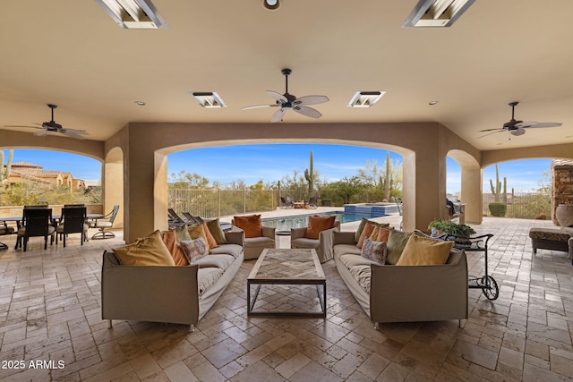 view of patio / terrace featuring an outdoor hangout area, outdoor dining area, and ceiling fan