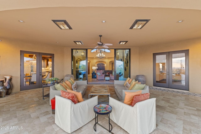 view of patio with french doors, ceiling fan, and an outdoor living space
