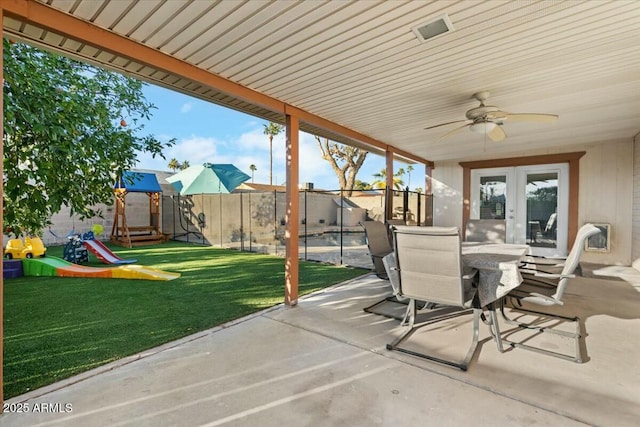 view of patio / terrace featuring a playground, outdoor dining area, a fenced backyard, and ceiling fan