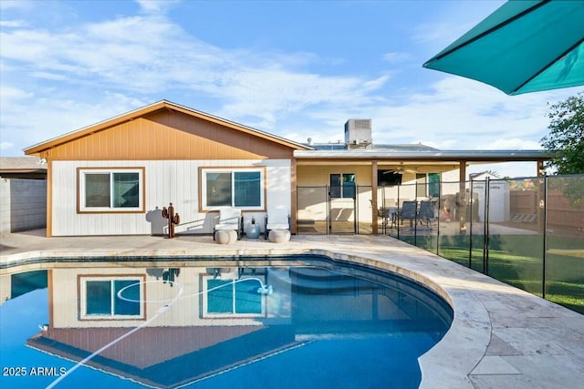 view of pool with a fenced in pool, a patio, and fence