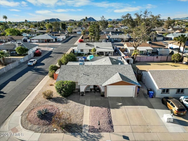 birds eye view of property with a residential view and a mountain view