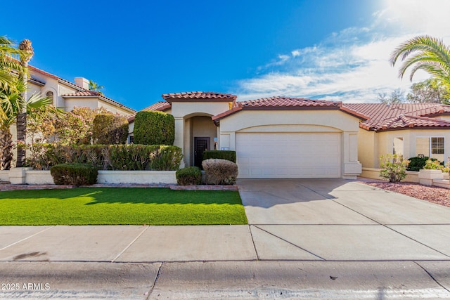 mediterranean / spanish house with a garage and a front yard