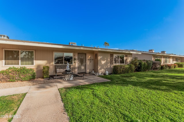 view of front of house with a front lawn