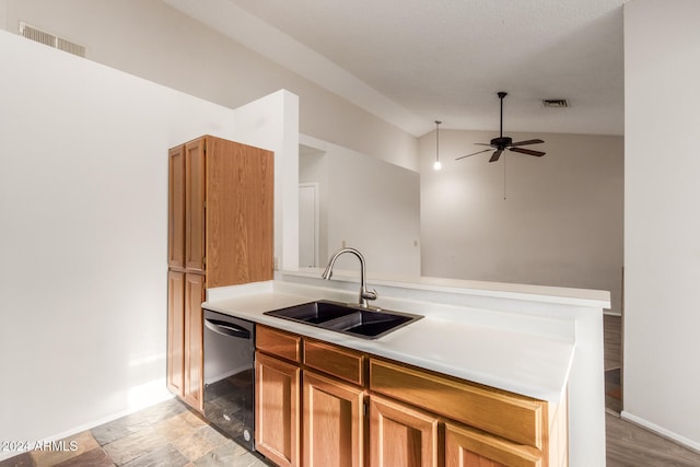 kitchen featuring ceiling fan, dishwasher, sink, light hardwood / wood-style flooring, and lofted ceiling