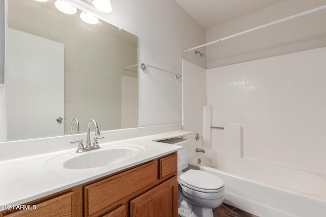 full bathroom with shower / bathing tub combination, vanity, and toilet