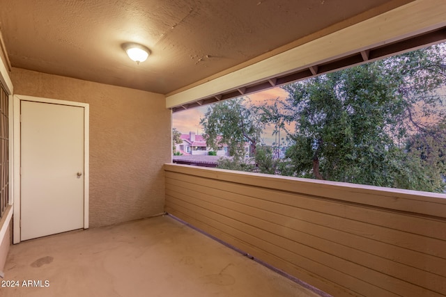 view of balcony at dusk