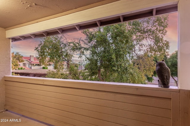 view of balcony at dusk