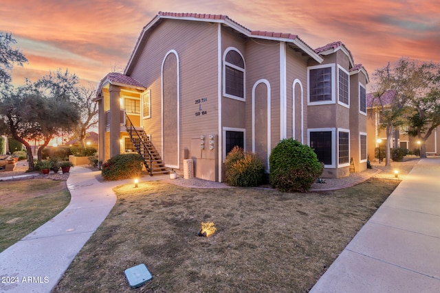 view of outdoor building at dusk