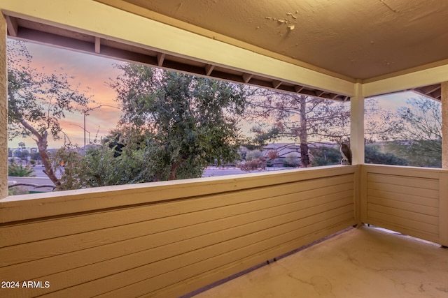 view of balcony at dusk