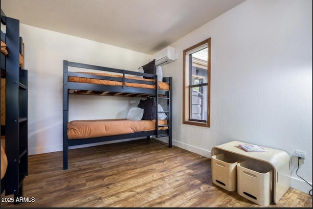 17405 S Shadow Rock Pl, Munds Park, AZ 86017 - bedroom featuring wood finished floors and a wall unit AC