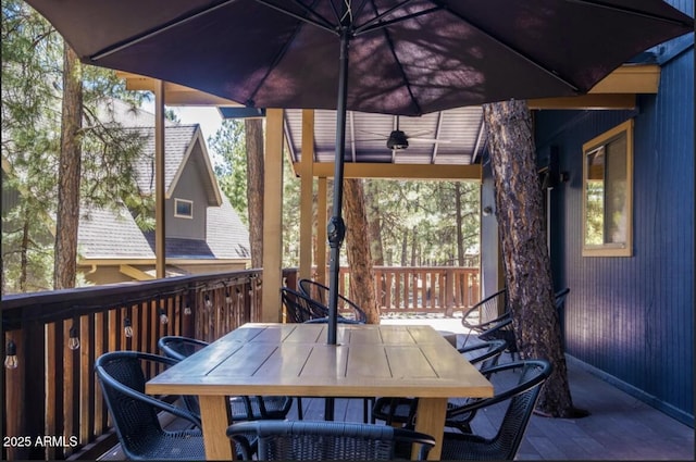 17405 S Shadow Rock Pl, Munds Park, AZ 86017 - wooden terrace with outdoor dining space and ceiling fan