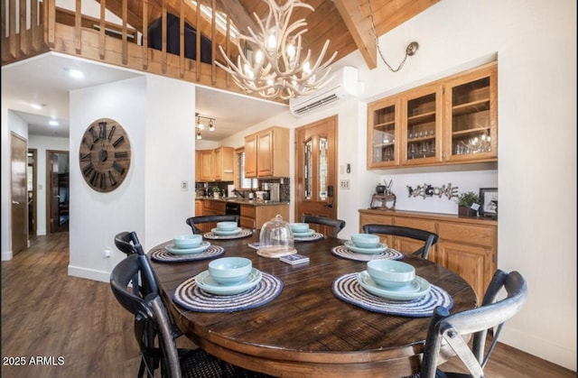 17405 S Shadow Rock Pl, Munds Park, AZ 86017 - dining space with an AC wall unit, a chandelier, dark wood finished floors, and beamed ceiling