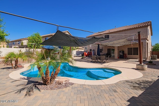 view of swimming pool with a patio area and central air condition unit