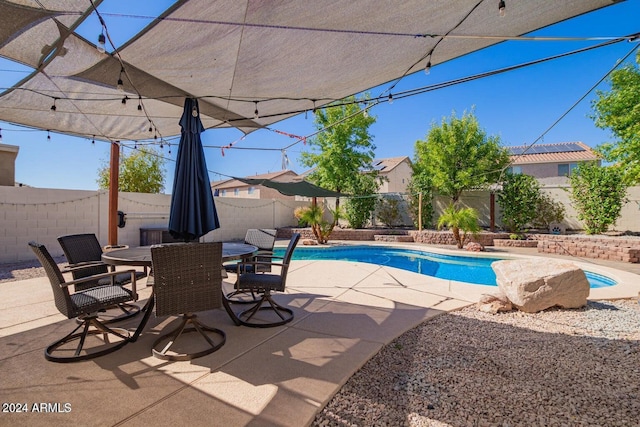 view of swimming pool featuring a patio area