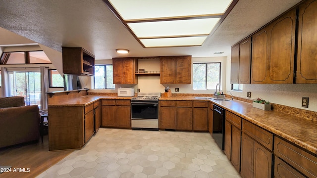 kitchen with sink, stainless steel range, a textured ceiling, and black dishwasher