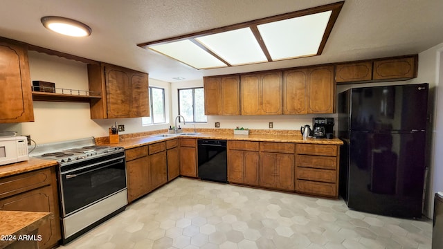 kitchen with sink and black appliances