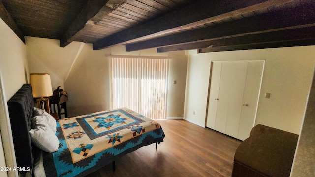 bedroom featuring beamed ceiling, wood-type flooring, and wooden ceiling