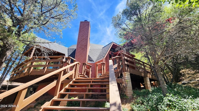 rear view of house featuring a deck