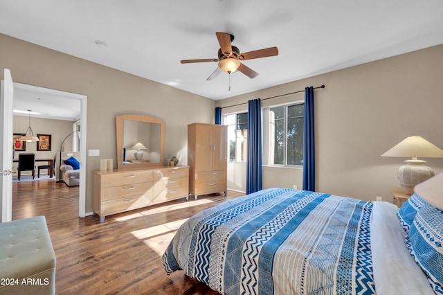 bedroom with hardwood / wood-style flooring and ceiling fan