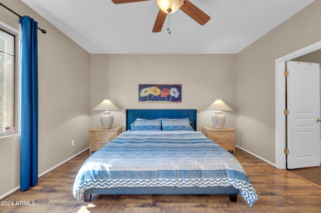 bedroom with hardwood / wood-style floors and ceiling fan