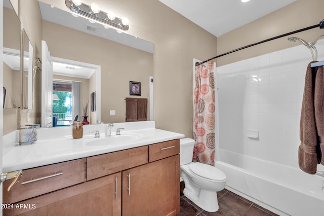 full bathroom featuring toilet, shower / tub combo, vanity, and tile patterned floors