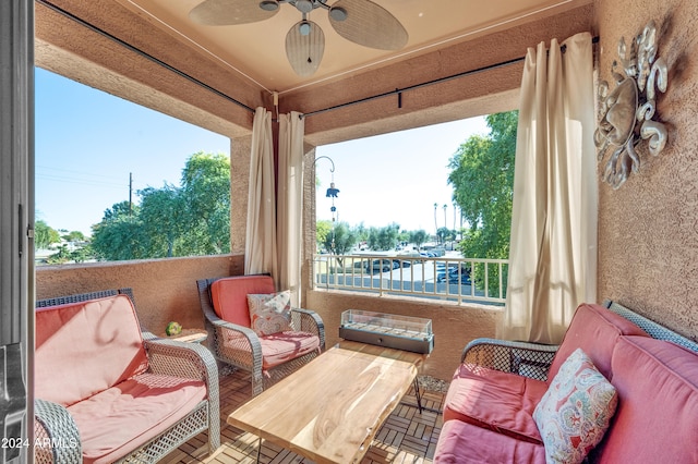 view of patio featuring a balcony and ceiling fan