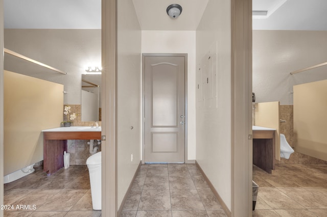 bathroom with tile patterned floors