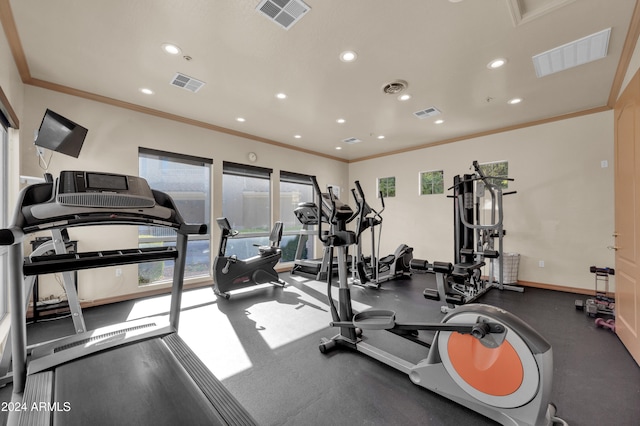 exercise room featuring ornamental molding