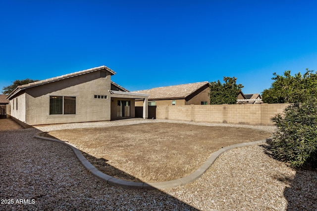 back of house with a patio area