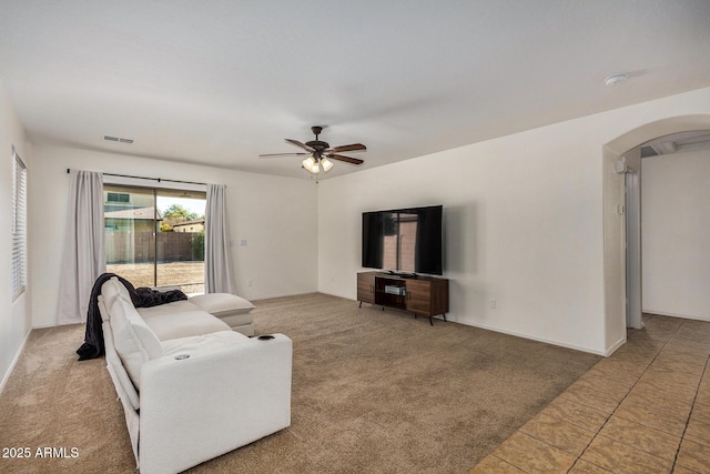 living room featuring ceiling fan and carpet flooring