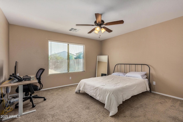 bedroom with ceiling fan and carpet floors