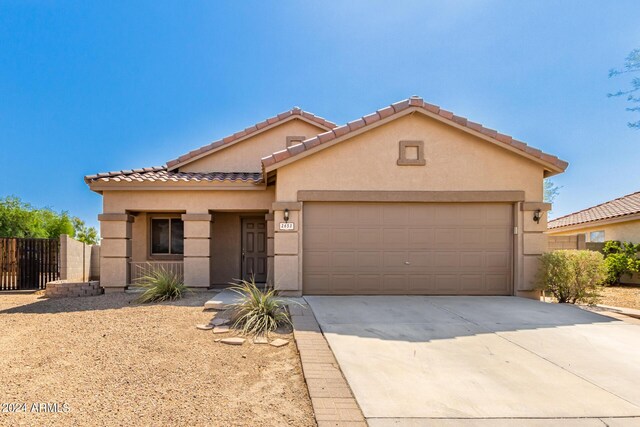 view of front of property with a garage