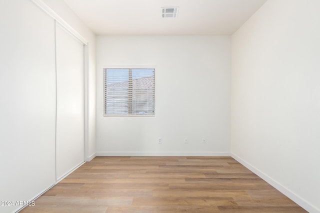 empty room with light wood-type flooring