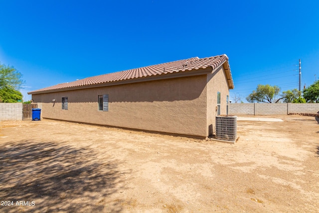 view of side of home featuring central air condition unit