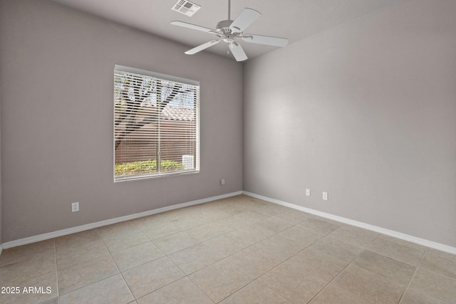 empty room with light tile patterned floors and ceiling fan