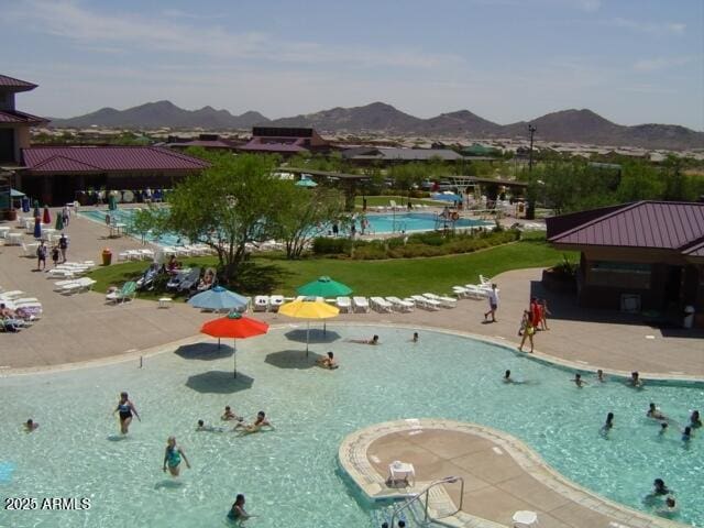 view of pool with a mountain view and a gazebo