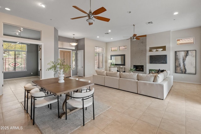 tiled dining room featuring ceiling fan