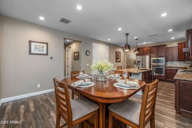 dining area featuring recessed lighting, visible vents, and dark wood-style floors