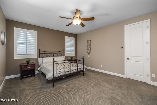 carpeted bedroom featuring baseboards and a ceiling fan