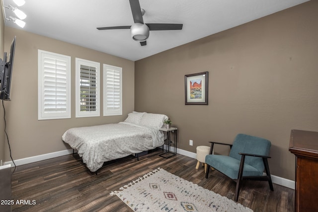 bedroom with baseboards, ceiling fan, and wood finished floors