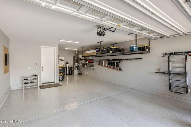 garage with water heater, baseboards, and a garage door opener