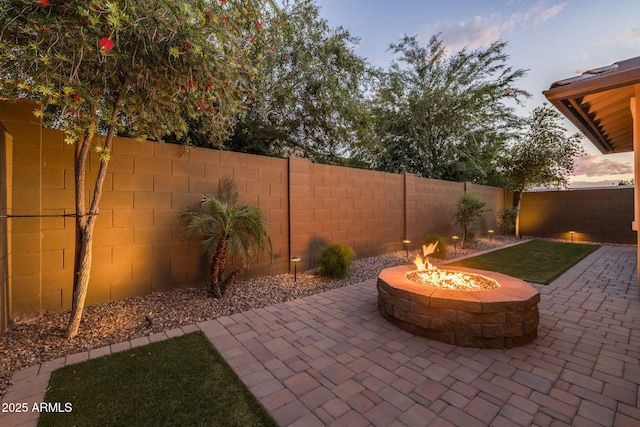view of patio featuring a fire pit and a fenced backyard