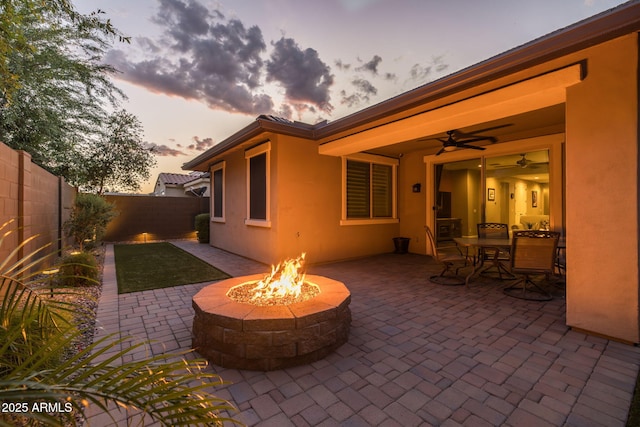 view of patio / terrace with a fire pit and a fenced backyard