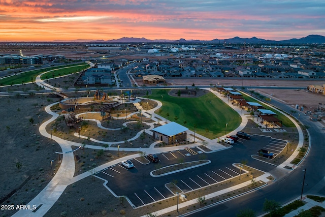 aerial view at dusk with a residential view and a mountain view