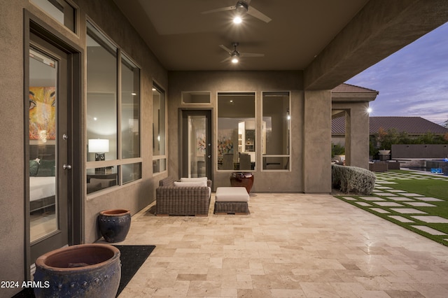 patio terrace at dusk with ceiling fan